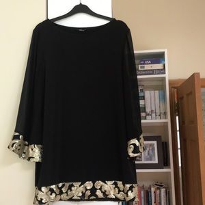 Black swing dress with gold sequin trim